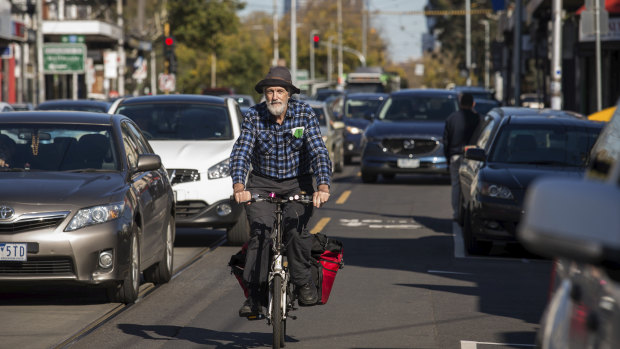 President of Revitalise Sydney Road Nic Dow. (Mr Dow is exempt from wearing a helmet.)