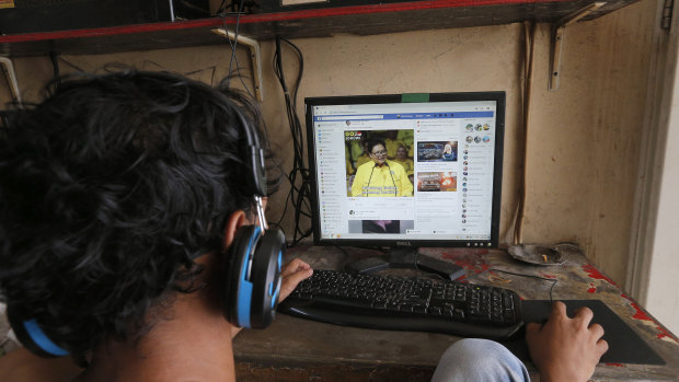 A young Indonesian browses his Facebook page at an internet cafe in Jakarta. Only one in six Indonesian homes has an internet connection.