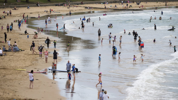 Crowds enjoying the beach in Torquay. The Surf Coast is expected to be busy this summer. 