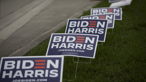 Biden Harris campaign signs are displayed outside an early voting polling location for the 2020 Presidential election in Miami, Florida.