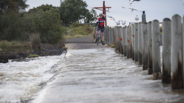 Ford Road in Altona is flooded after wild weather and a heavy downpour of rain overnight.