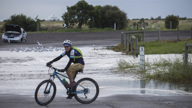 Ford Road in Altona is flooded after wild weather and a heavy downpour of rain overnight.