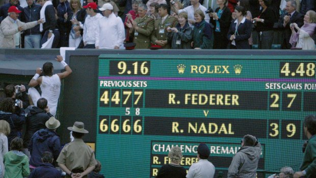 Classic match: Nadal climbs into the stands next to the scoreboard telling the tale in 2008.