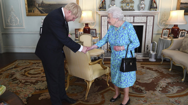 It was soon hot in London this week, a modern portable air-conditioning tower can be seen among the period decoration of Buckingham Palace reception room where the Queen invited Boris Johnson to become prime minister.