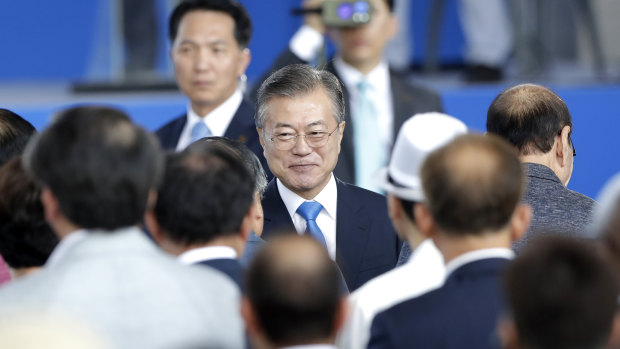 Son of defectors: South Korean President Moon Jae-in, centre.