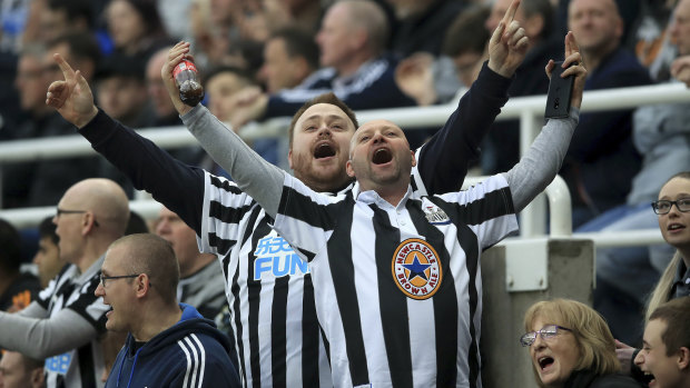 Exuberant: Newcastle fans show their support.