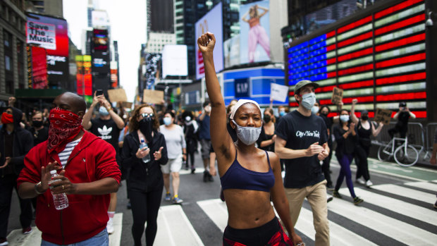 Protesters in New York City's Times Square. By voicing solidarity with the black community, brands are trying to gain credibility
