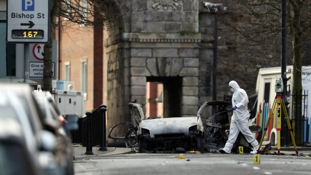 Forensic investigators at the scene of a car bomb in Londonderry, Northern Ireland, in January.