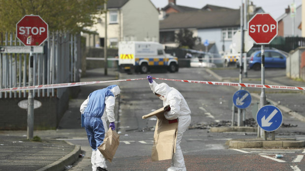 Police forensic officers at the scene in Londonderry, Northern Ireland.