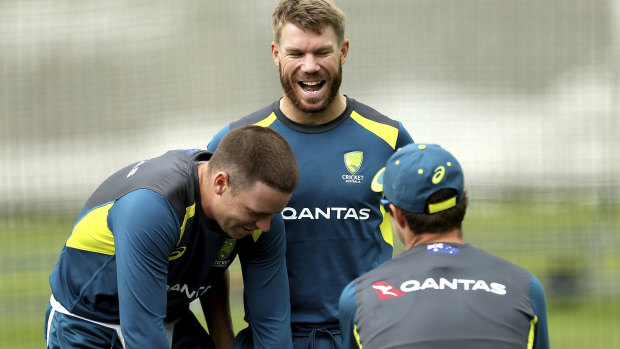 Ready to roll: Warner shares a joke with Josh Hazlewood and Mitchell Starc in the nets at Lord's.