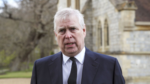 Prince Andrew speaks outside a memorial service for Prince Philip earlier this year, in a rare public appearance.