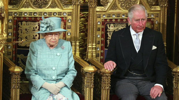The Queen and Prince Charles sit in the chamber ahead of the ceremonial opening of parliament in Britain.