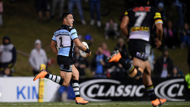Full bore: Valentine Holmes streaks away to score against the Panthers on Friday night.