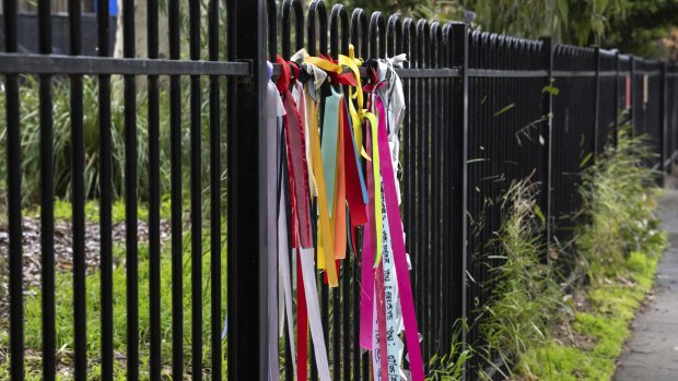 Ribbons attached to the fence at Beaumaris Primary School in support of childhood victim survivors of historical sexual abuse.