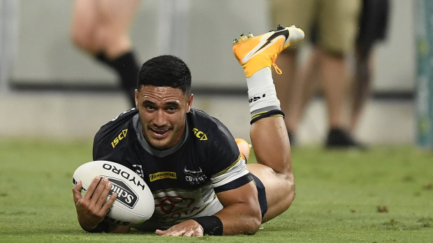 Winners are grinners: Valentine Holmes seals North Queensland's win.