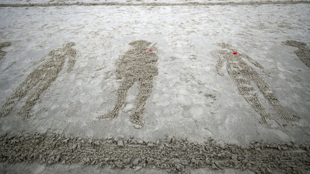 Drawings of soldiers on Sunny Sands beach in Folkestone,  England during the Pages of the Sea commemorative event to mark the 100th anniversary of the end of WWI. The homage to fallen servicemen and women was the idea of filmmaker Danny Boyle and intended as an informal gesture of remembrance. 