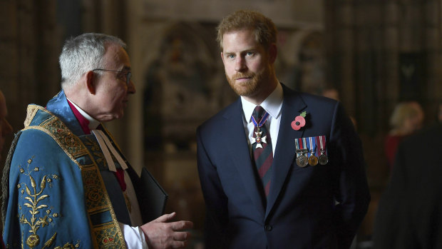 Britain's Prince Harry, the Duke of Sussex listens to the Dean of Westminster Dr John Hall as he leaves the Anzac Day Service of Commemoration and Thanksgiving at Westminster Abbey, in London.