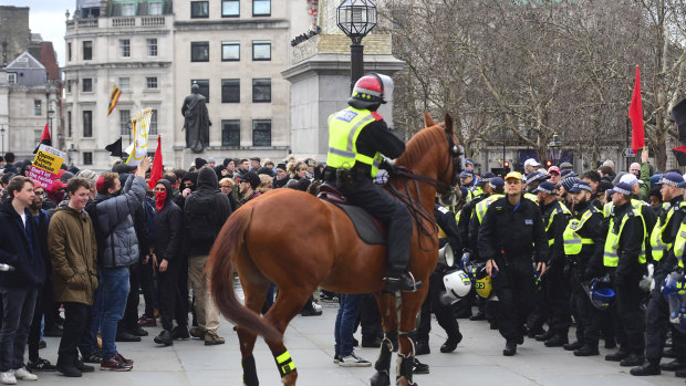 Police attempt to keep rival Brexit protest groups from clashing in central London on Sunday.