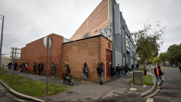 The queue for emergency food relief at a Southbank charity in Melbourne. The coronavirus outbreak has highlighted the nation's dependence on foreign students and casual workers.
