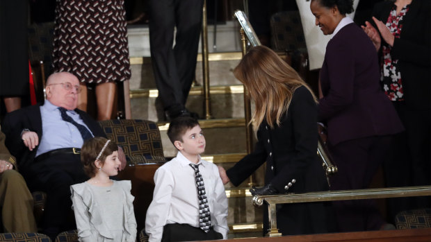 Guests Grace Eline and Joshua Trump, no relation, greet first lady Melania Trump before Donald Trump delivers his speech. Joshua was invited on the account of bullying he has suffered for his surname.