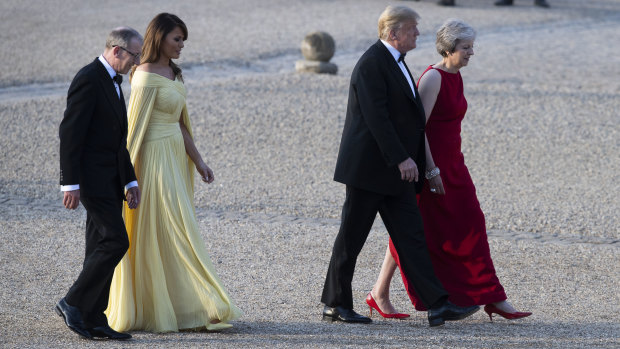 Donald Trump, Theresa May, front and Melania Trump, and May\'s husband Philip, arrive at Blenheim Palace on Thursday.