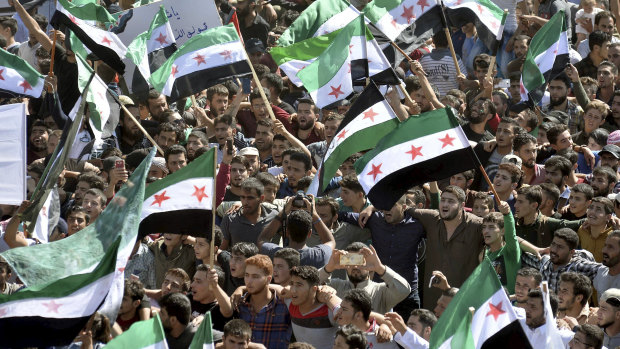 Protesters attend a demonstration against the Syrian government's expected offensive to Idlib, in the northwestern town of Maarat al-Numan,  south of Idlib, Syria, on Friday.