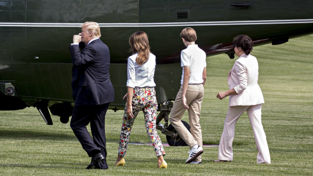 US President Donald Trump, from left, First Lady Melania Trump, their son Barron and Amalija Knavs cross the South Lawn of the White House before boarding Marine One in June.