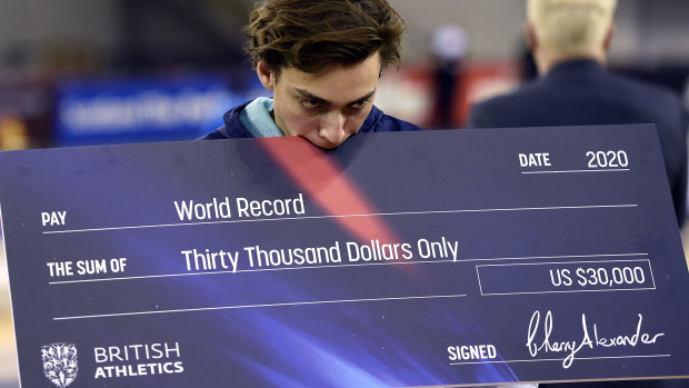 Duplantis with his cheque reward.