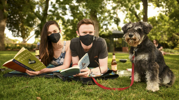 Stevie the three year old Mini Schnauzer with her owners Emma Barker-Perez and Connell Bergin enjoying a beautiful spring day at the St Kilda Botanical Gardens.