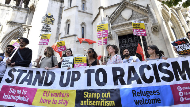 Demonstrators against far-right activist Tommy Robinson protest outside London's  Royal Courts of Justice last week. Robinson was released on bail while he appeals a 13-month jail sentence for live-streaming outside a criminal trial in violation of reporting restrictions. 