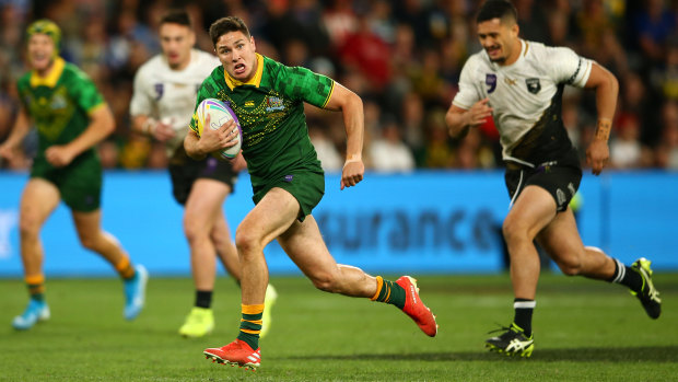 Mitchell Moses bursts into the clear to score a try for Australia in the final on Saturday night.
