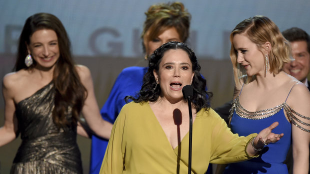 Alex Borstein, front left, and Rachel Brosnahan accept the award for outstanding performance by an ensemble in a comedy series for The Marvelous Mrs. Maisel at the 26th annual Screen Actors Guild Awards. 