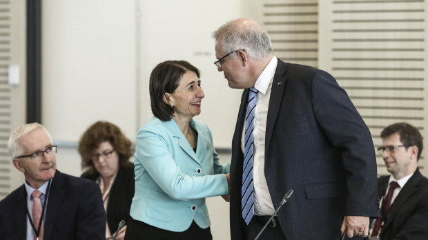 Prime Minister Scott Morrison greets NSW Premier Gladys Berejiklian ahead of the COAG meeting in Parramatta on Friday morning.
