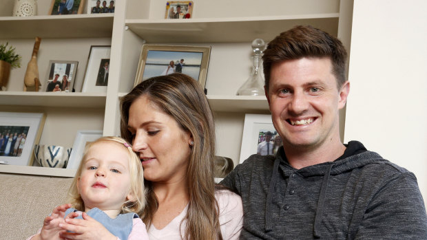 All clear: Emily McQualter, then two, with her parents Jane and Andrew.