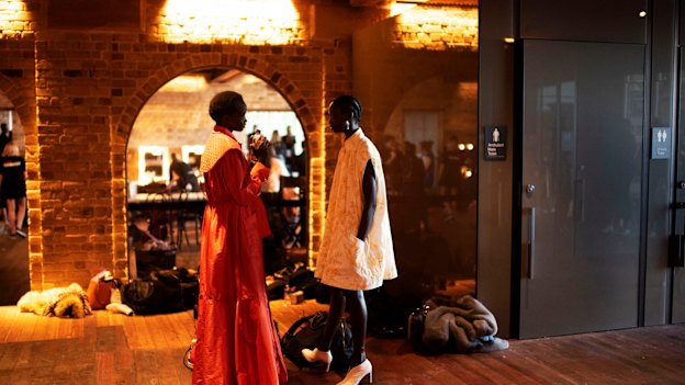 Models get ready to hit the runway.