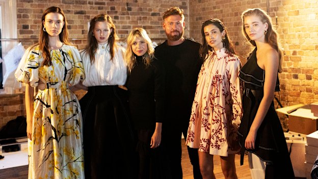 Fashion designers Edwina Forrest and Adrian Norris (in black, centre) of  fashion label Aje.