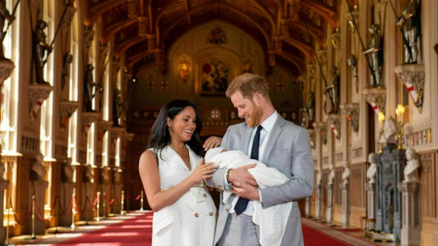 The Duke and Duchess of Sussex with newborn son Archie in St George’s Hall at Windsor Castle.