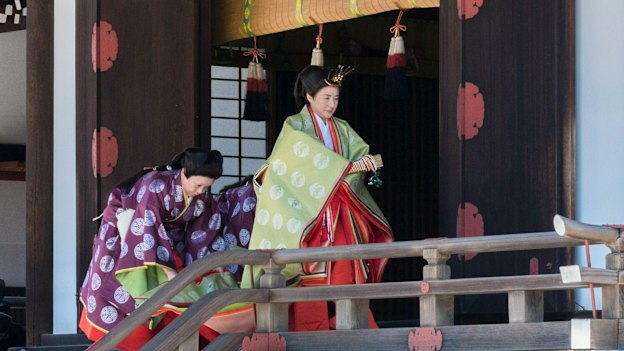 Empress Masako on her way to report the date of her husband's enthronement ceremony  to the imperial ancestors in May.