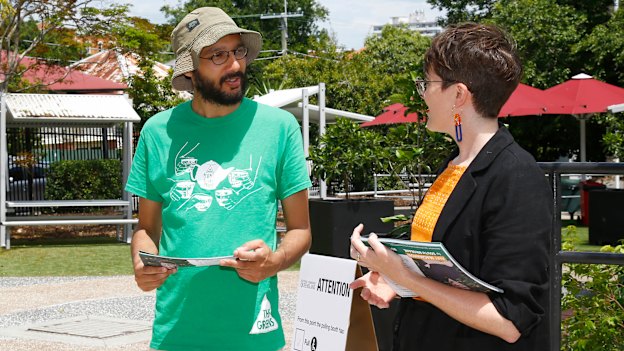Jonathan Sri (left, pictured with South Brisbane Greens MP Amy MacMahon on state election day) says it is hard for smaller parties to attract working-class candidates.