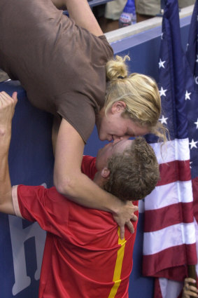 Lleyton Hewitt kisses Kim Clijsters after his victory.