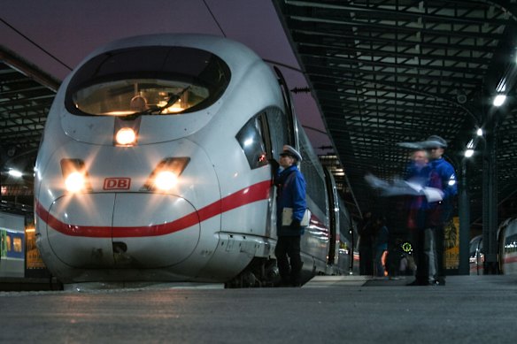 Rail crew prepare for the departure of a high-speed inter-city train at Paris Gare de l’Est. 