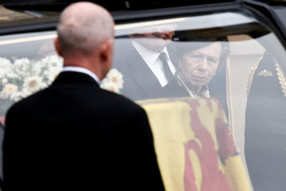 Princess Anne, Princess Royal, watches as the hearse carrying the coffin of Queen Elizabeth II arrives at the Palace of Holyroodhouse.