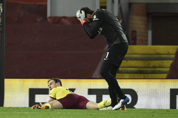 Liverpool goalkeeper Alisson reacts after fouling Ashley Barnes of Burnley, leading to the latter's match-winning penalty.