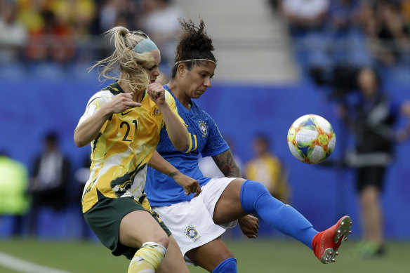 Australia's Ellie Carpenter battles with Brazil's Cristiane.