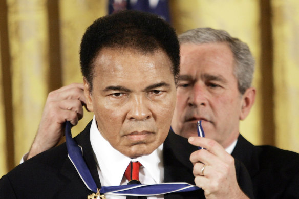 In 2009, US president George W Bush presents the Presidential Medal of Freedom to Muhammad Ali.
