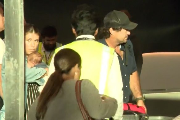 Matt Wright and wife Kaia at Sydney airport on Tuesday. 