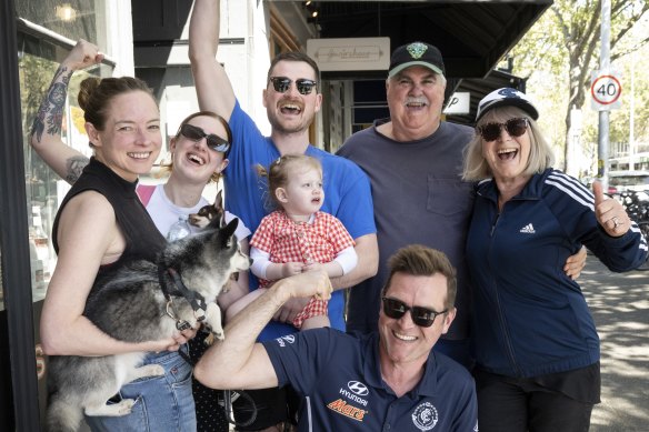 The Anning family on Lygon Street in Carlton after the Blues win on Friday.