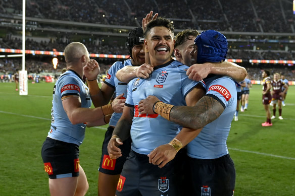 Latrell Mitchell and the Blues celebrate another try.