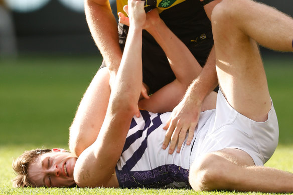 Jye Amiss of the Dockers and Ben Miller of Richmond wrestle during Sunday’s match.