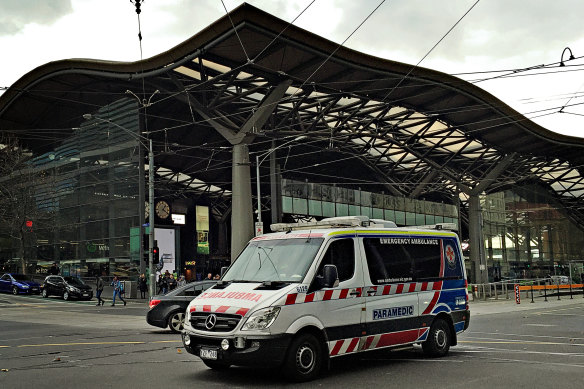An ambulance travels through Melbourne’s CBD. 